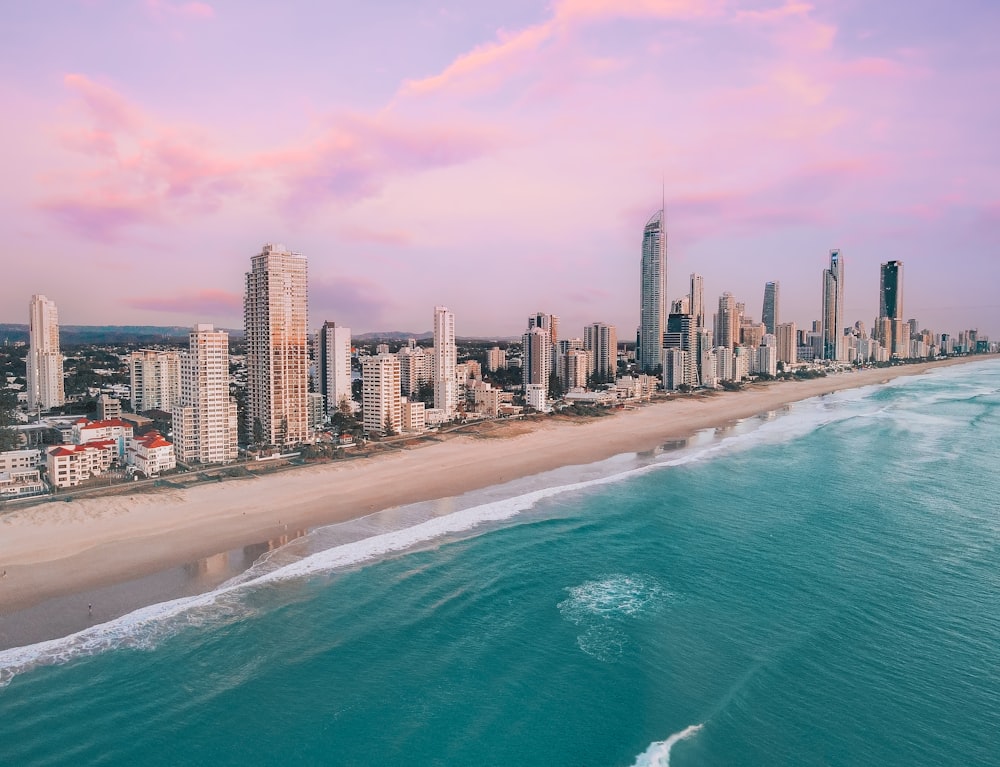 an aerial view of a city and the ocean