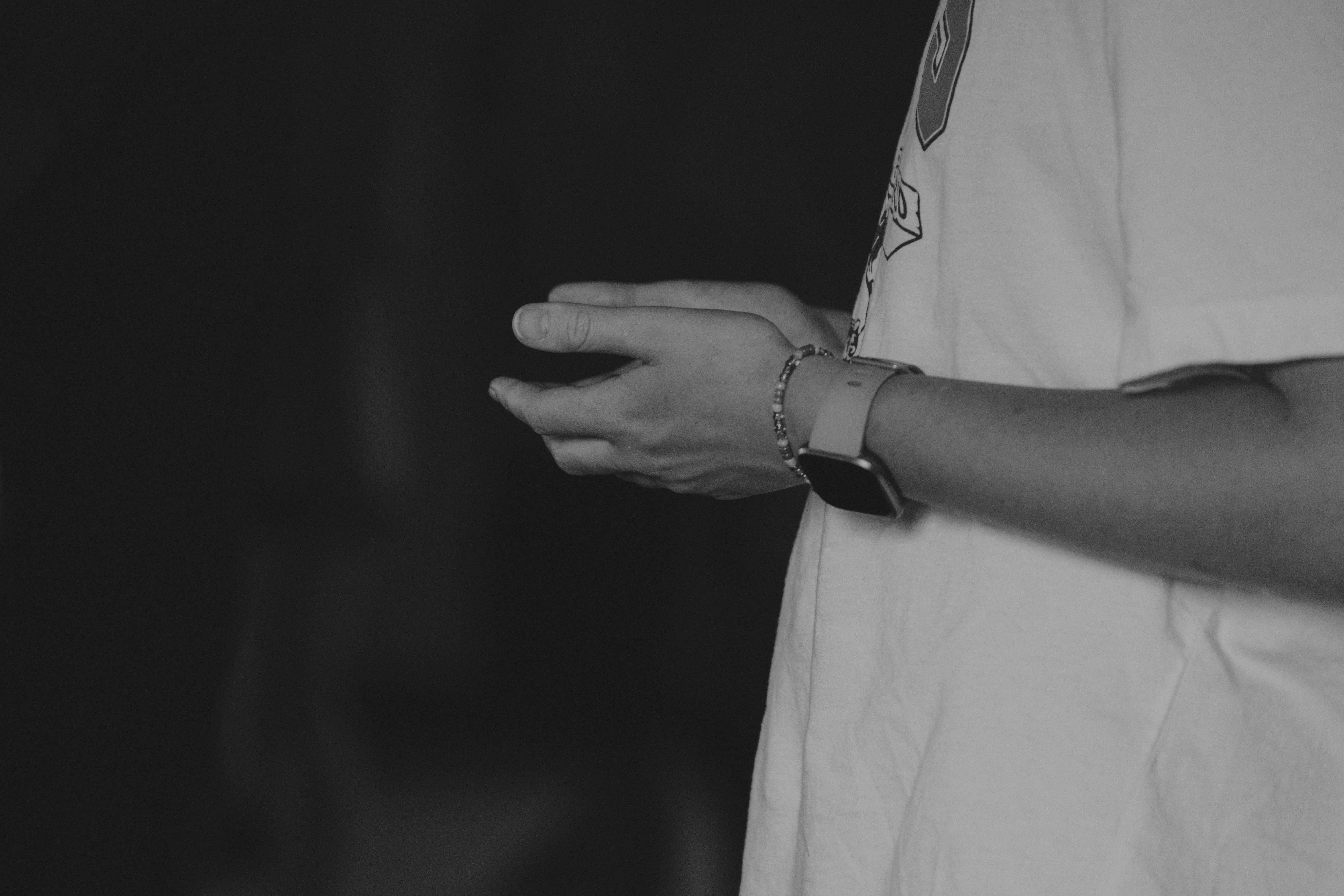 a black and white photo of a person's hands
