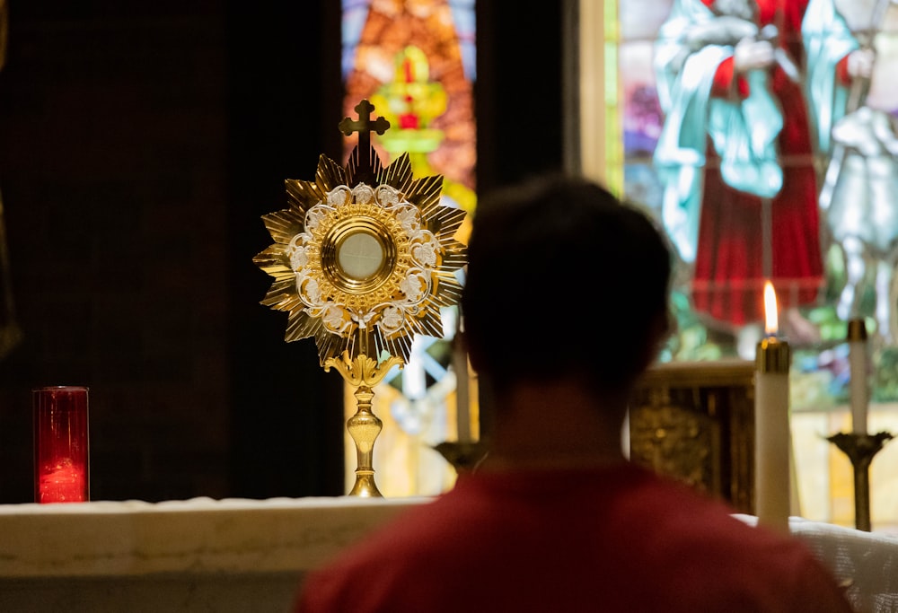 a man standing in front of a church alter