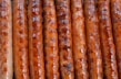 a close up of a bunch of sausages on a grill