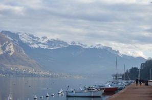a group of boats sitting on top of a body of water