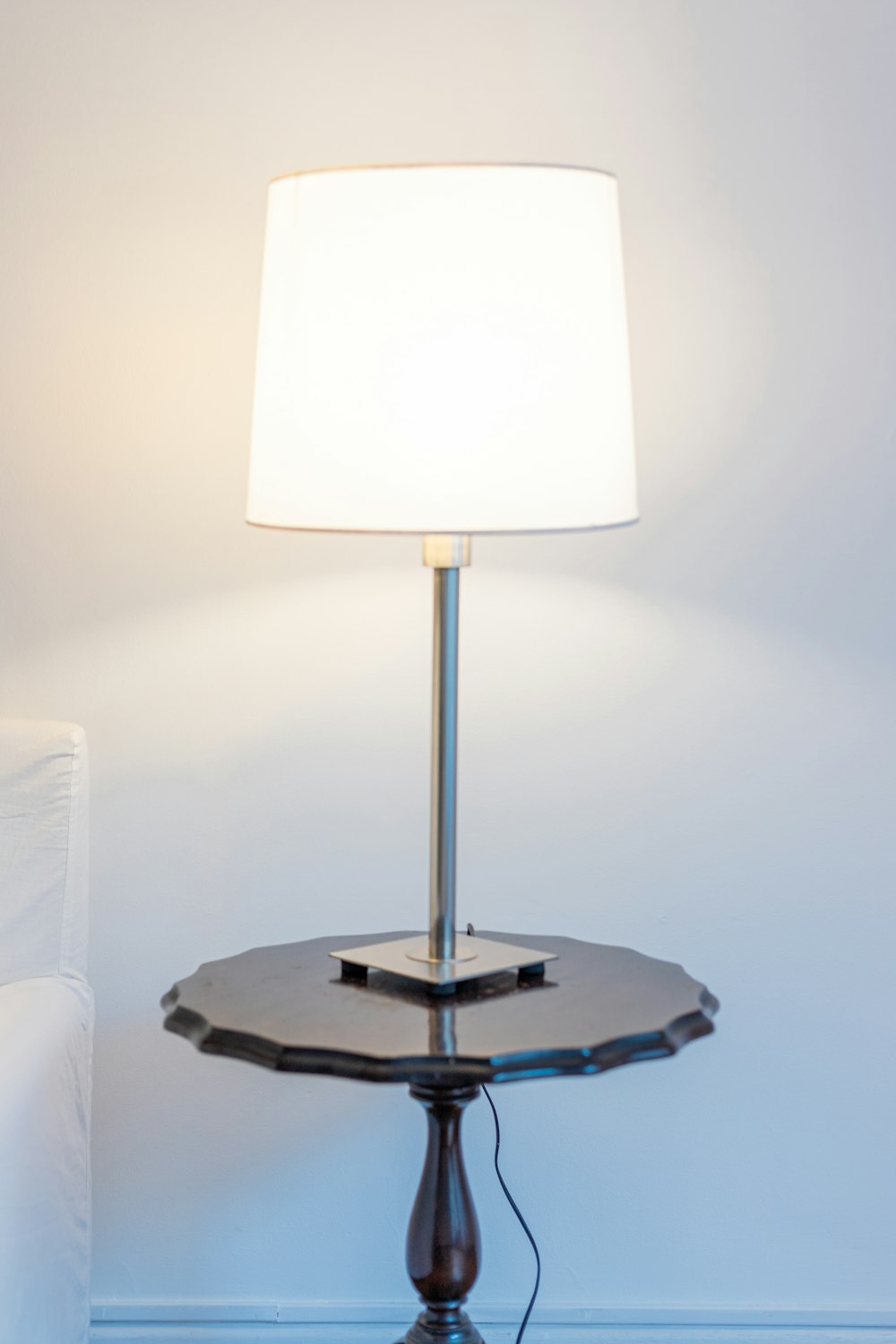 a table with a lamp on top of it