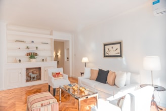 a living room filled with furniture and a fire place