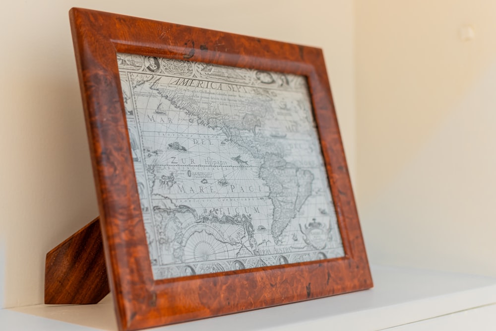 a wooden frame with a map on it