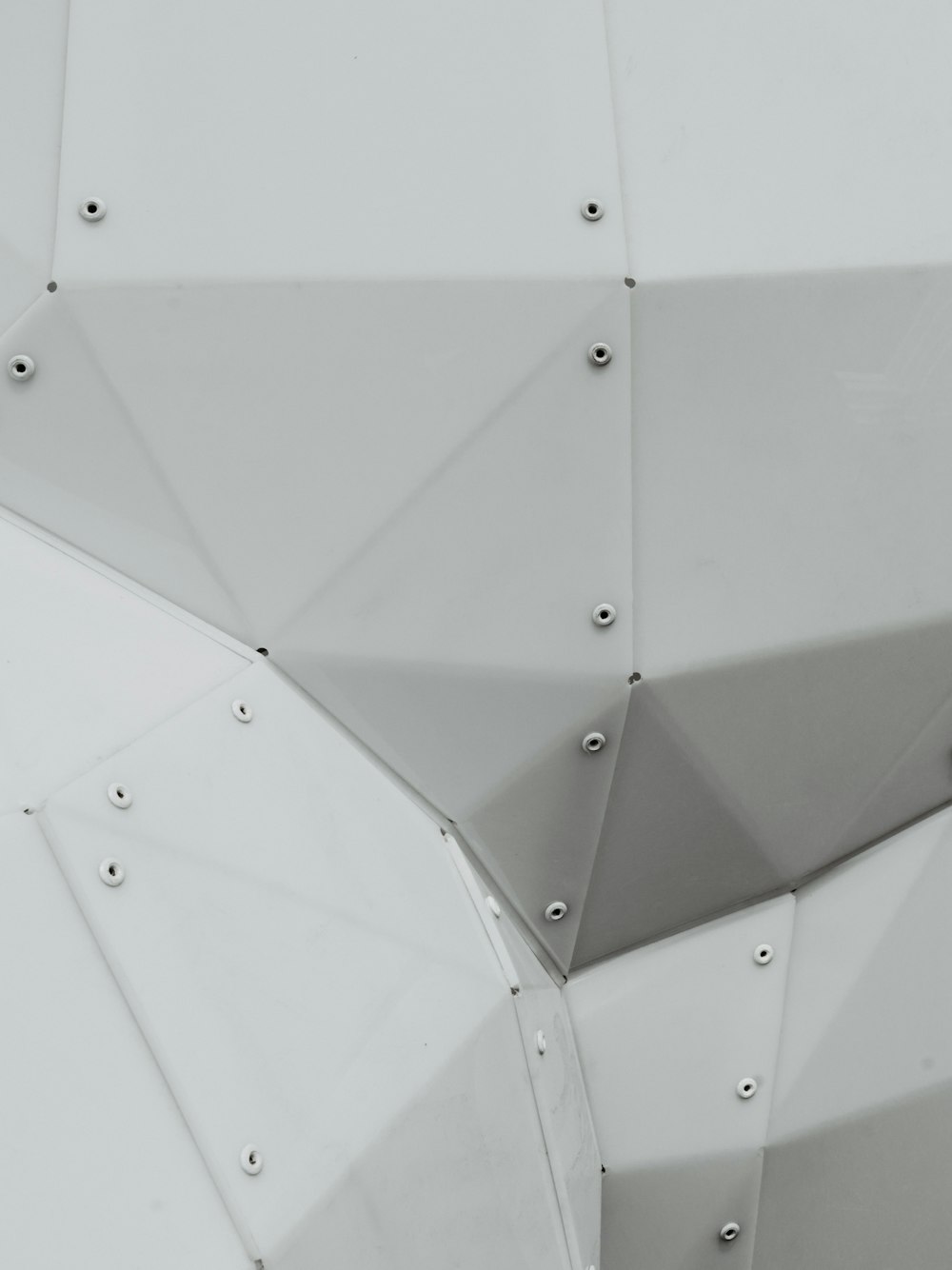 a close up of a metal structure with rivets