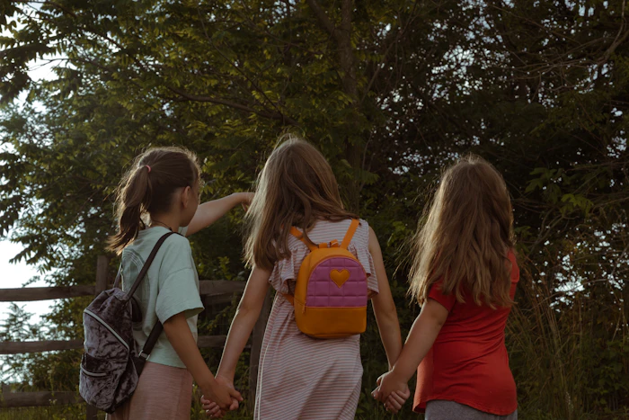 Young children walking hand in hand
