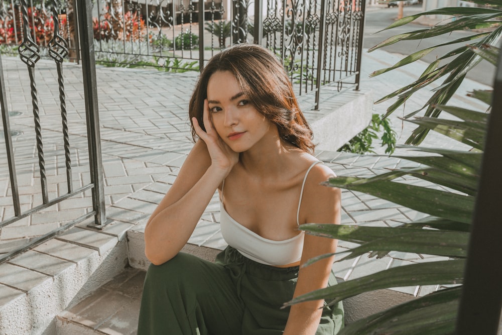 a woman sitting on the steps of a building