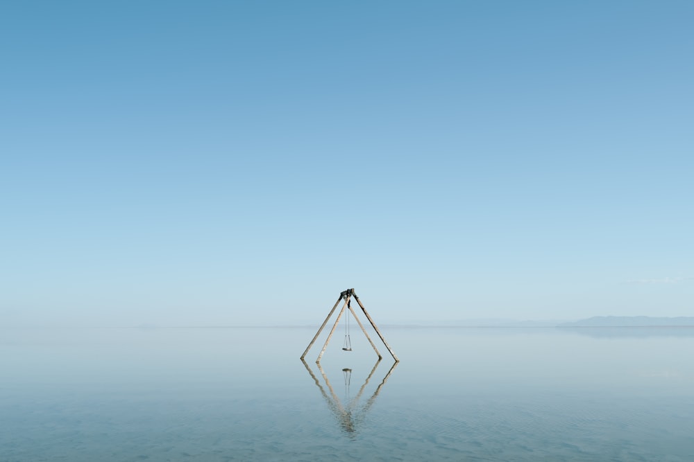 a large body of water with a small object in the middle of it