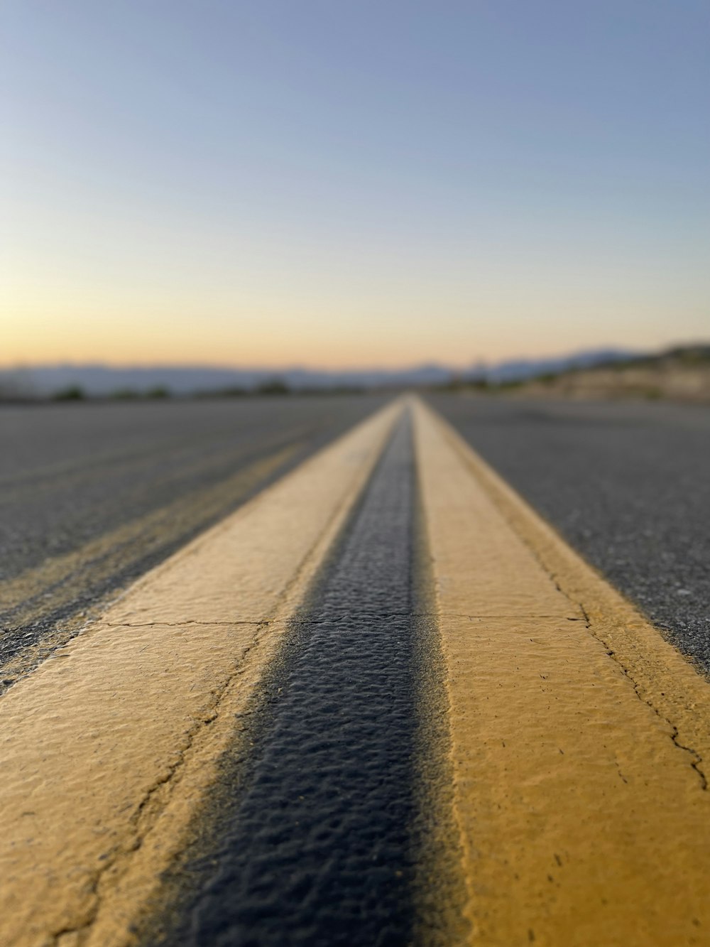 a long straight road with no cars on it