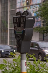 Close-up of a modern parking tag device installed on a vehicle.