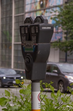 Close-up of a modern parking tag device installed on a vehicle.