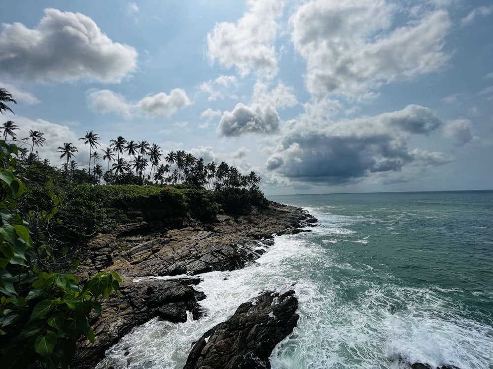 a view of the ocean from a rocky cliff