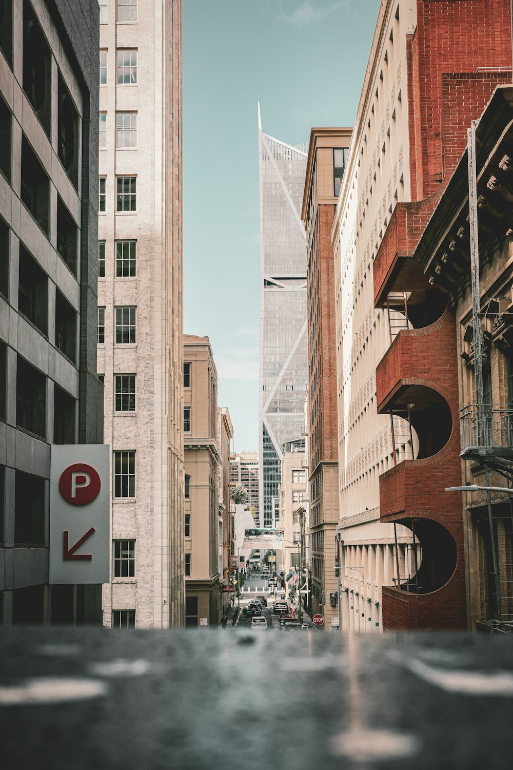 a city street filled with tall buildings next to tall buildings