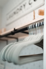 a row of clothes hanging on a rack