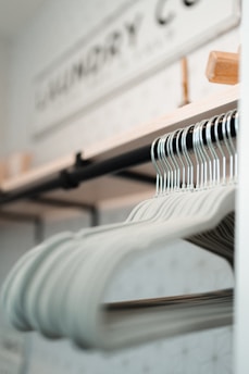 a row of clothes hanging on a rack