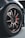 A close-up view of a car wheel with a detailed focus on the alloy rim and tire. The tire bears the brand name 'Potenza' and 'Bridgestone', and the wheel has a metallic finish with several spokes. The background is slightly blurred, highlighting the wheel as the focal point.