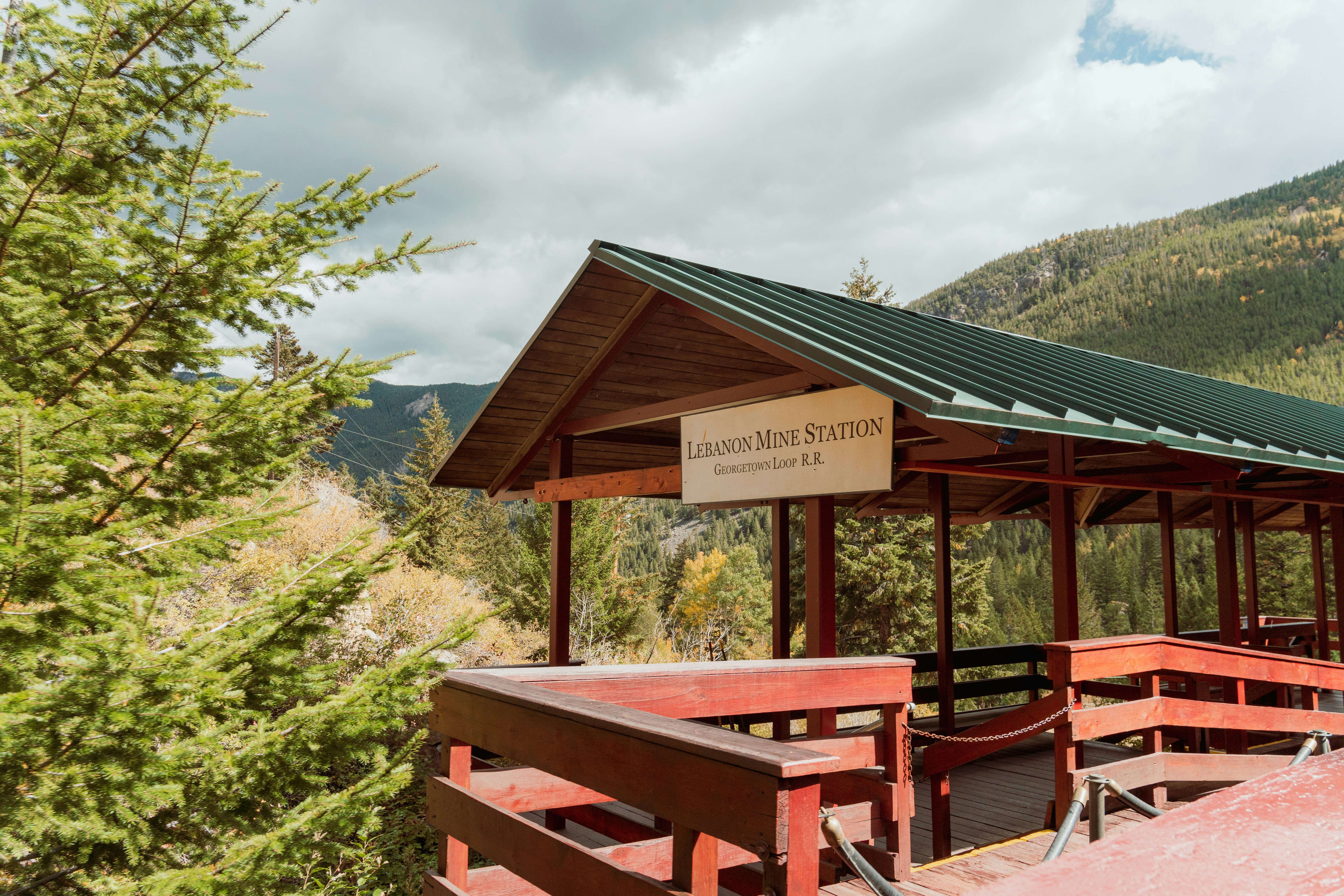 a wooden structure with a sign on top of it