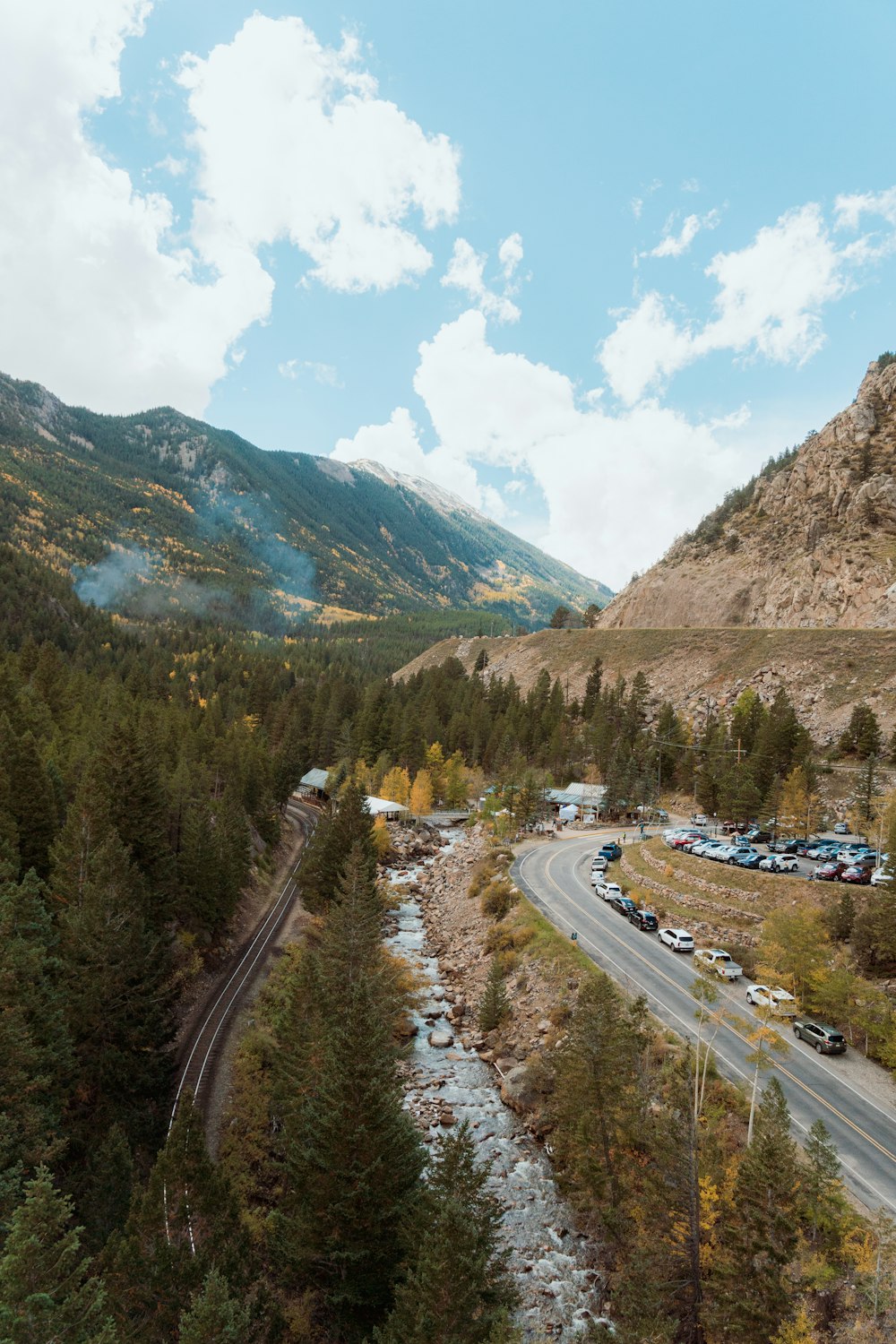 a scenic view of a mountain with a river running through it