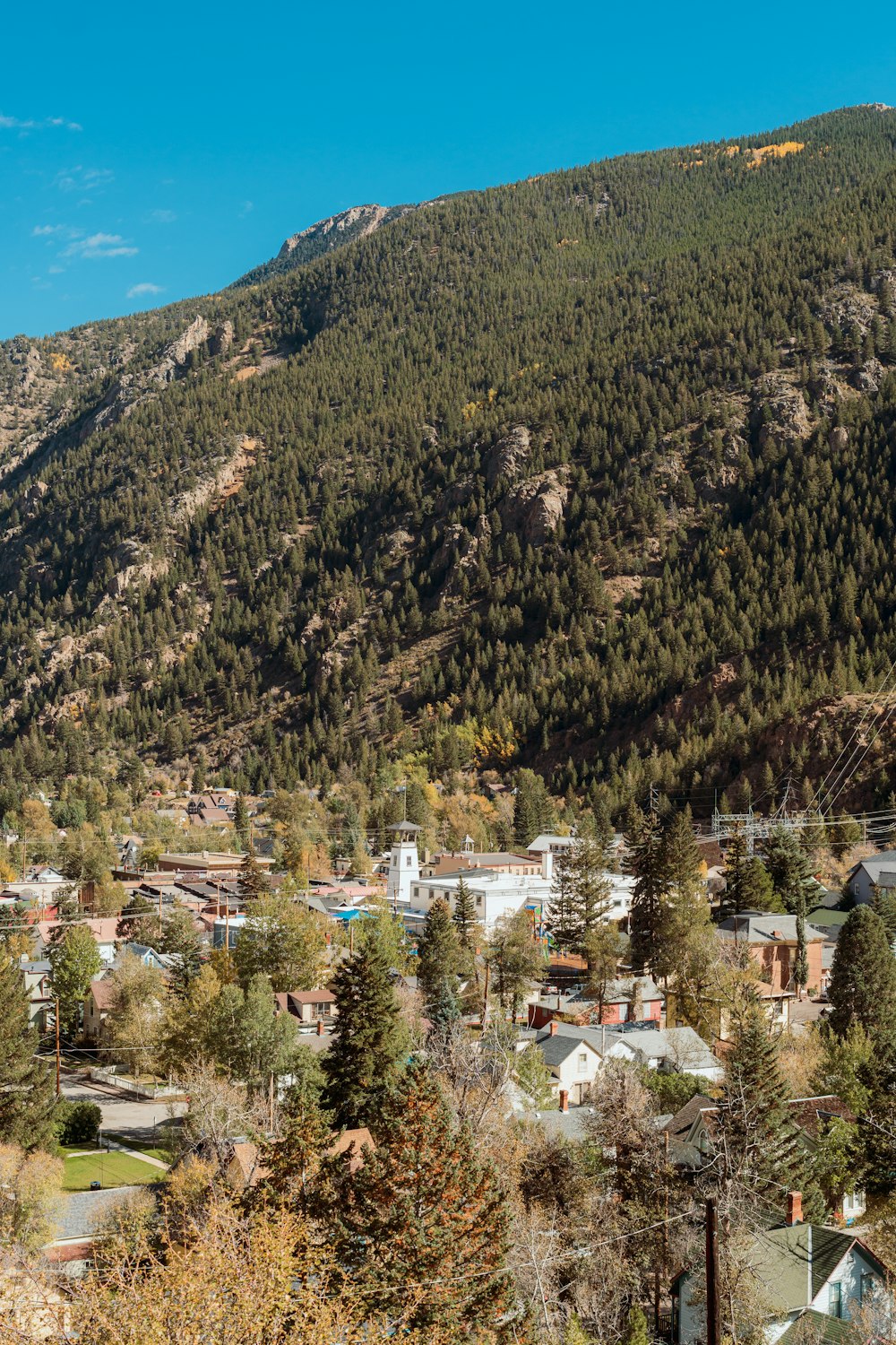 a view of a small town in the mountains