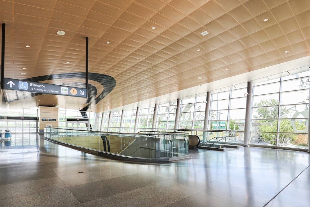 an empty luggage carousel in an airport terminal