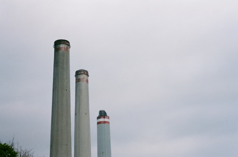 a couple of smoke stacks sitting next to each other