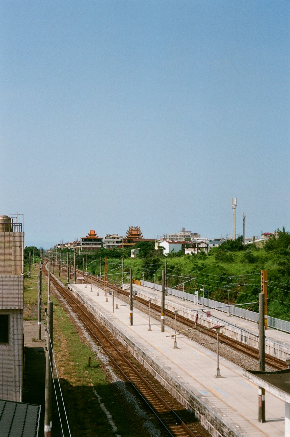 a train station with a train on the tracks