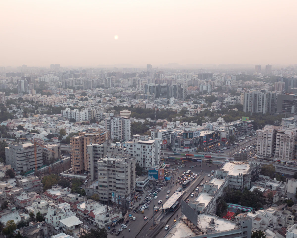 Aerial view of Ahmedabad's modern skyline at sunset