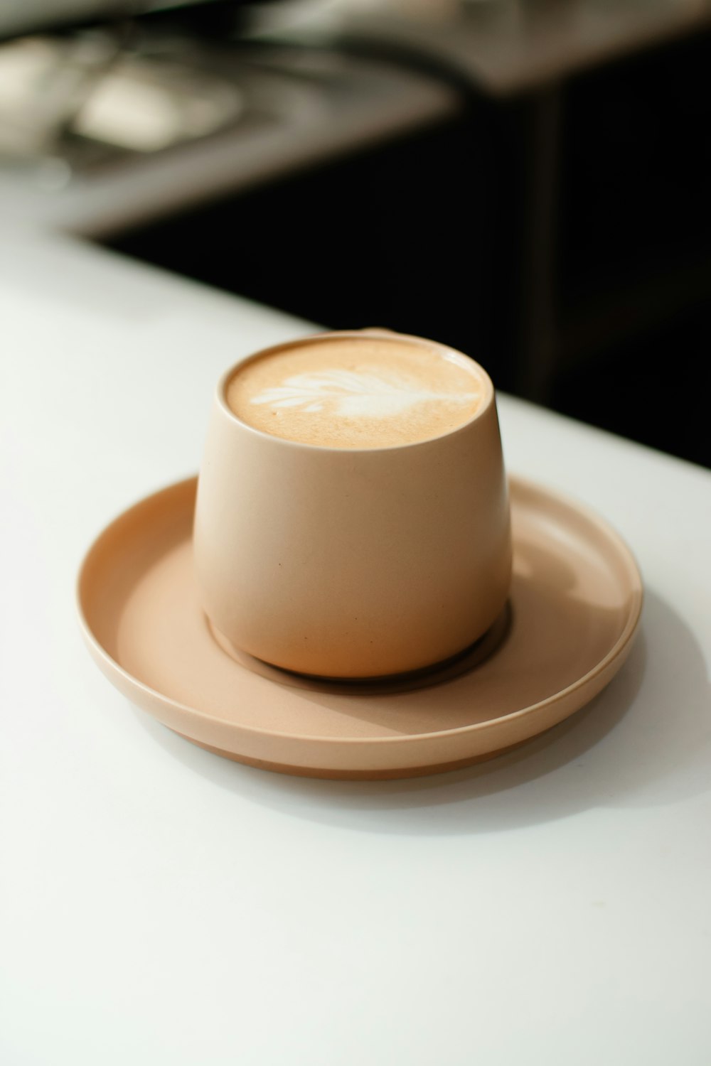 a cup of coffee sitting on top of a saucer