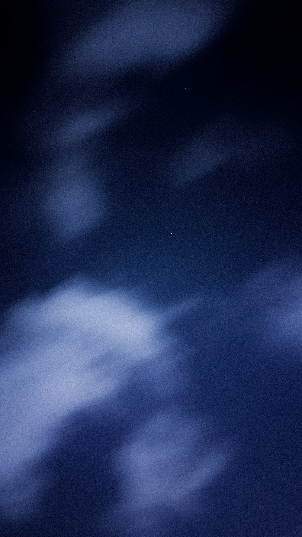 a plane flying in the sky at night