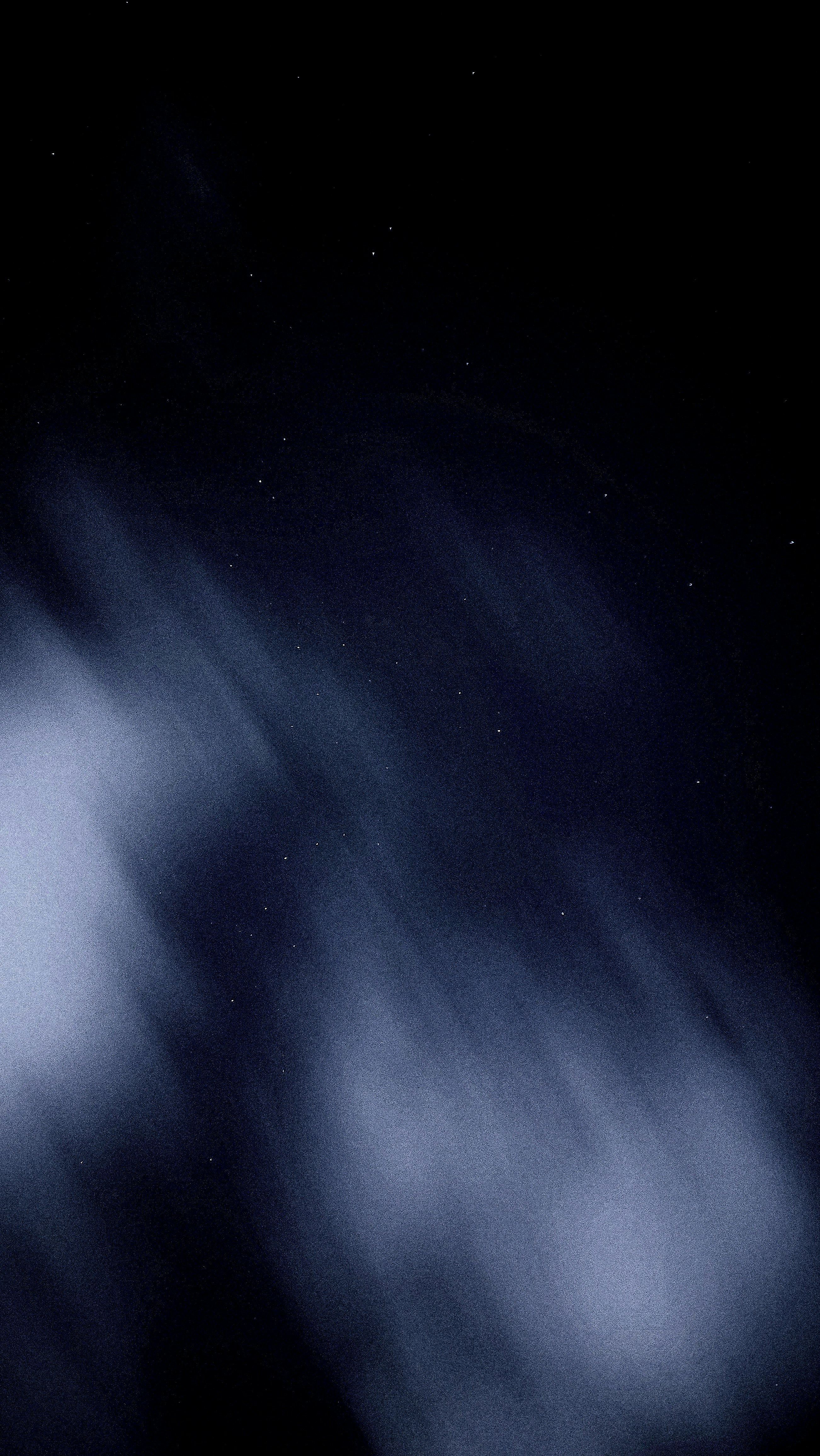 a black and white photo of the night sky