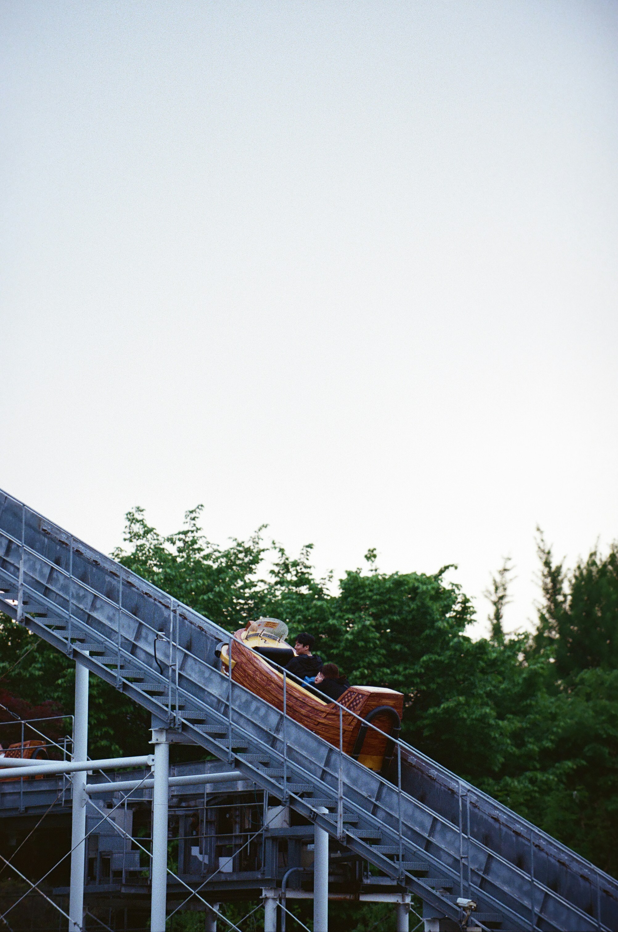 a person riding a roller coaster down a hill