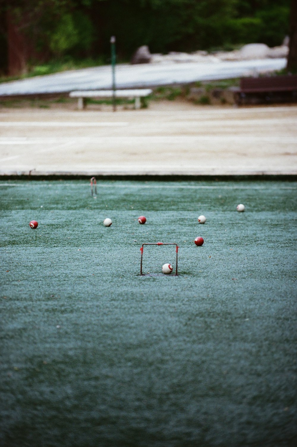 a group of people playing a game of croquet