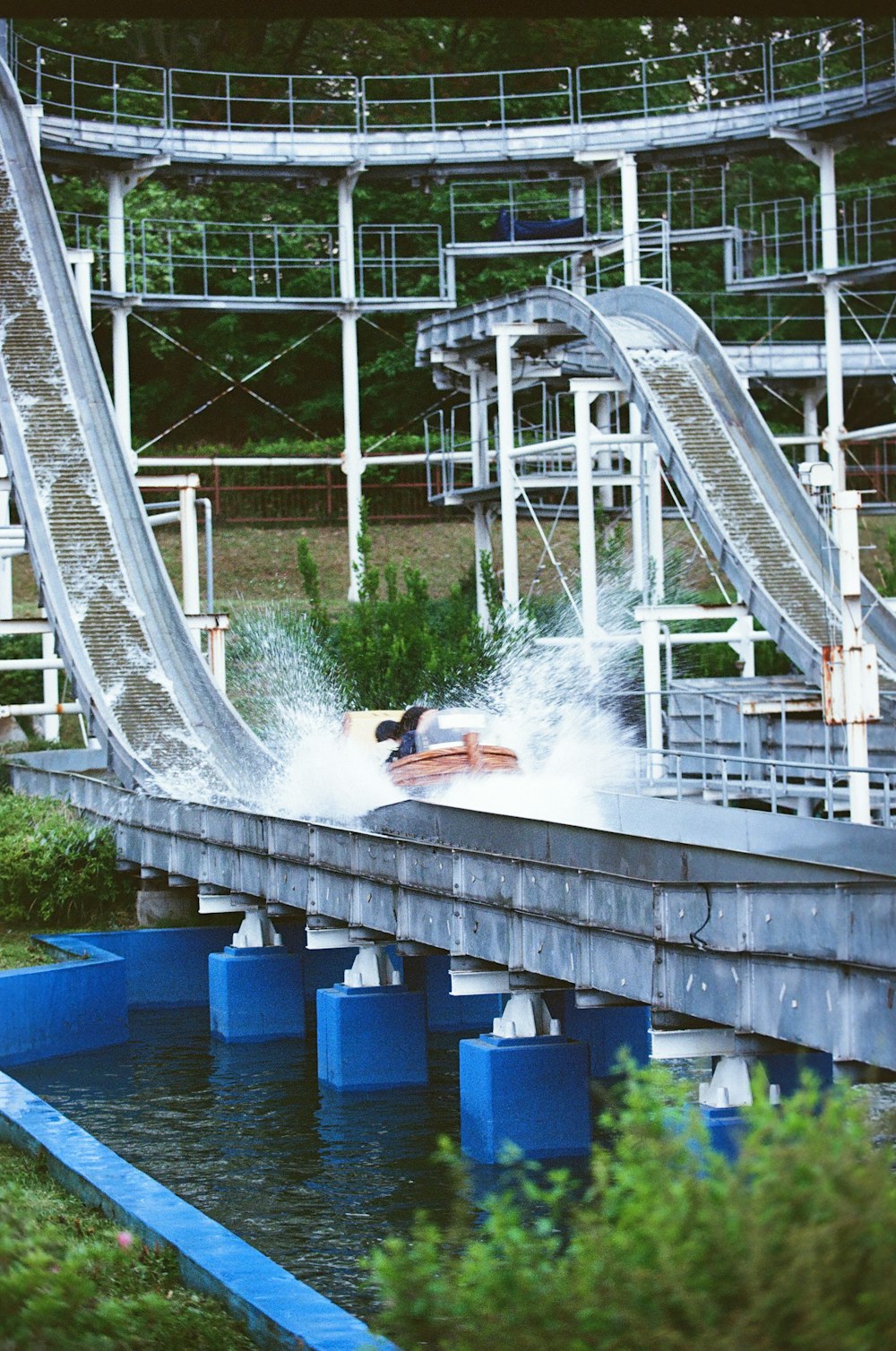 a water slide going over a body of water