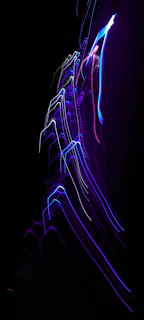 Close-up of sleek 3D lines and light trails in violet neon over a black background