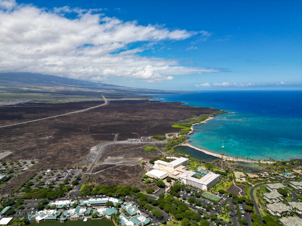 an aerial view of a city near the ocean