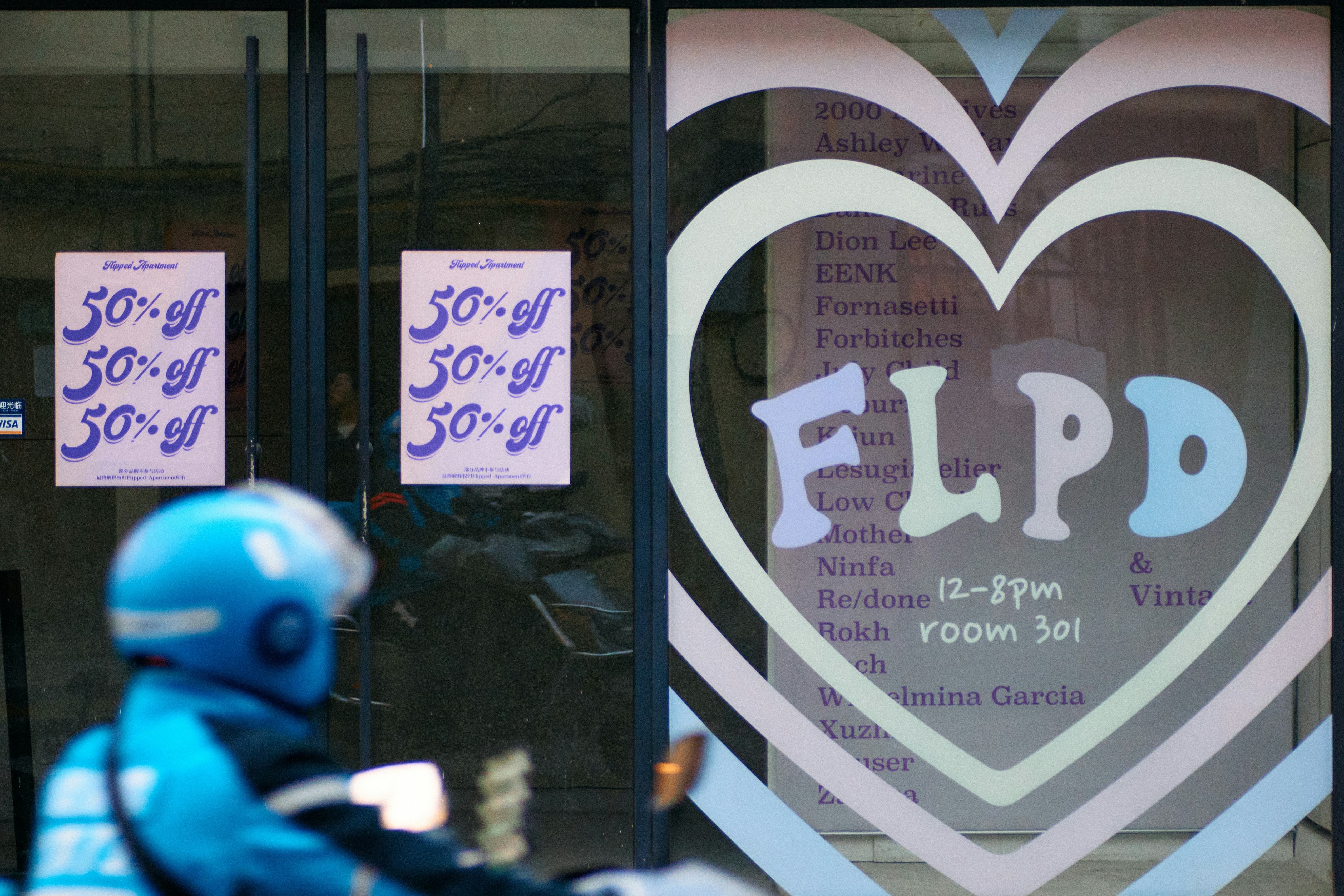 a person in a blue helmet is riding a motorcycle