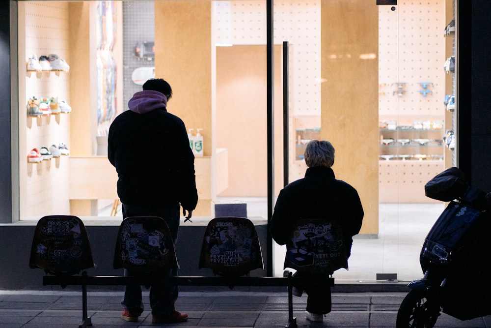 a couple of people that are standing in front of a building