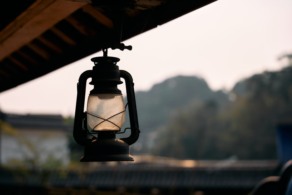 a lantern hanging from the side of a building