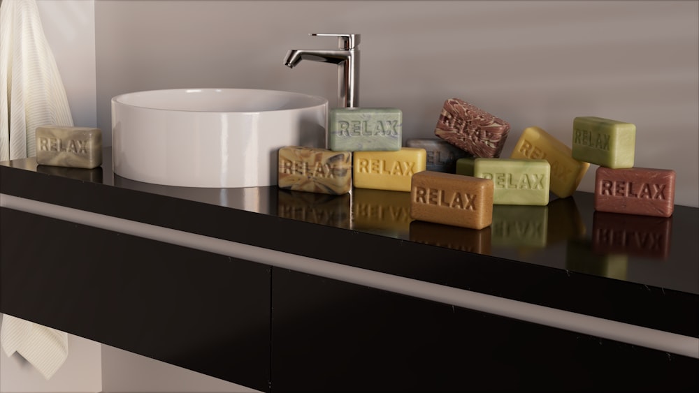 a bathroom counter with soap bars and a sink
