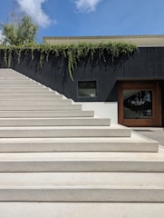 a set of concrete steps leading up to a building