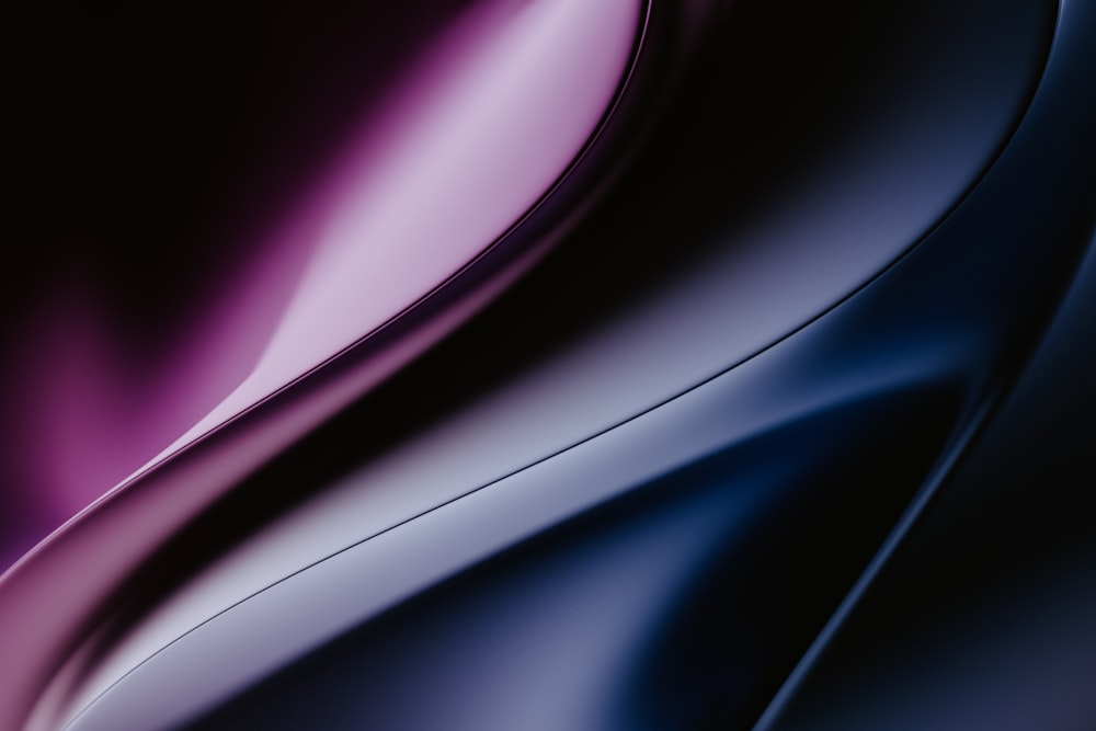 a close up of a purple and black background