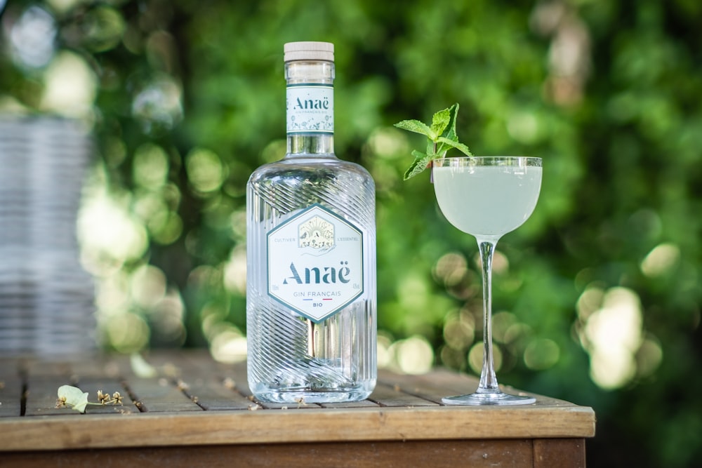 a bottle of gin and a glass on a table