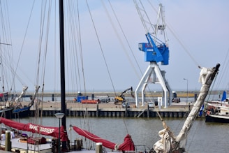 a group of sailboats docked at a pier