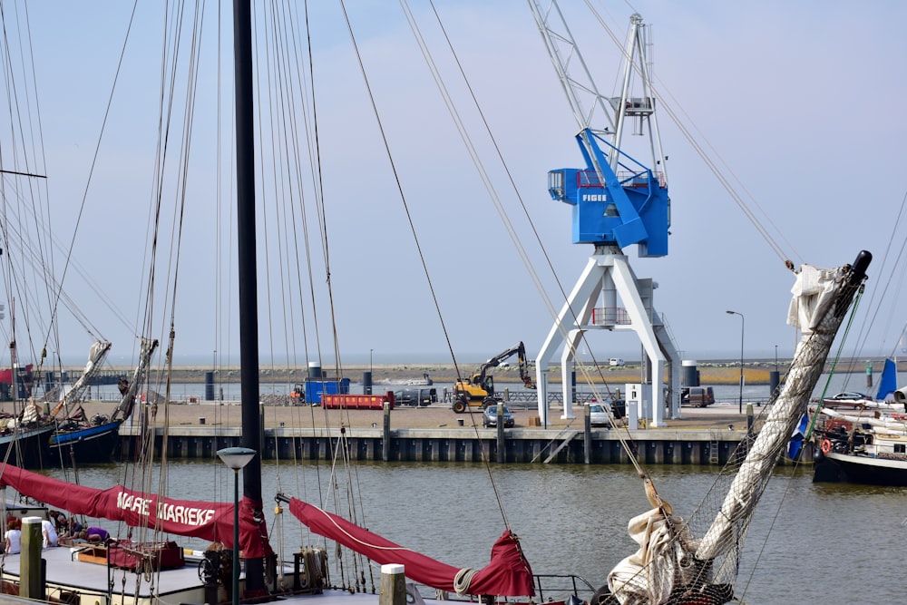 a group of sailboats docked at a pier