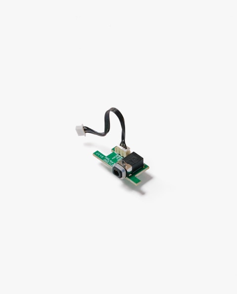 a close up of a piece of electronics on a white surface