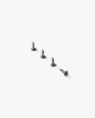 Set of sturdy screws and handles arranged on a dark wooden board.