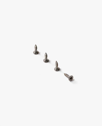 A neat row of screws with sharp tips and steel gray finish on a textured background.