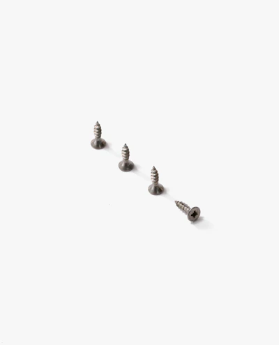 A neat row of screws with sharp tips and steel gray finish on a textured background.