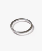 Close-up of a shiny rubber o-ring resting on a metal surface, highlighting its smooth texture.