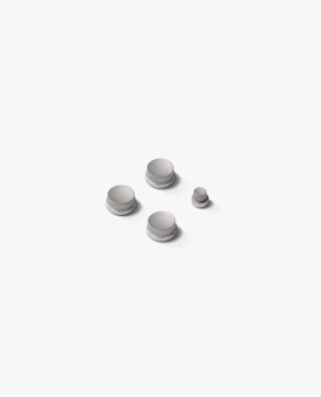 a group of white buttons sitting on top of a white surface